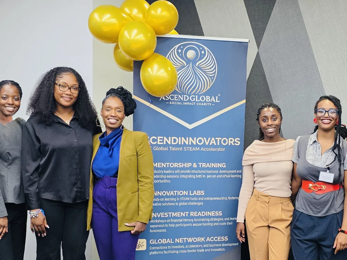 Members of the cohort together in front of the Ascend banner
